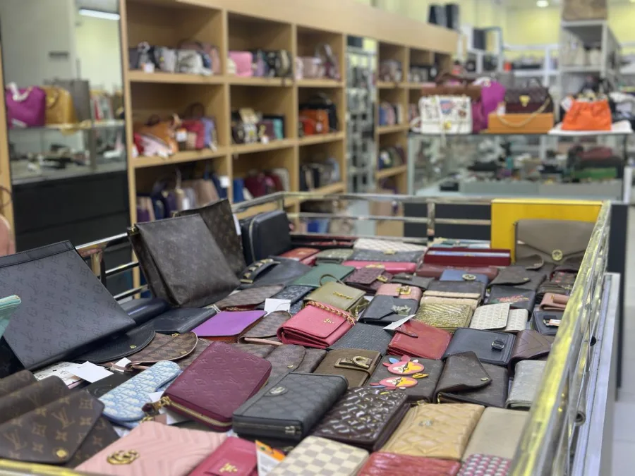 Close-up of an assorted wallet and small leather goods display